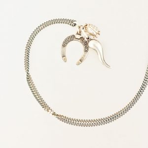 Lucky Necklace #8 is made from vintage sterling silver chain and three vintage sterling silver charms with symbols that are supposed to bring luck.